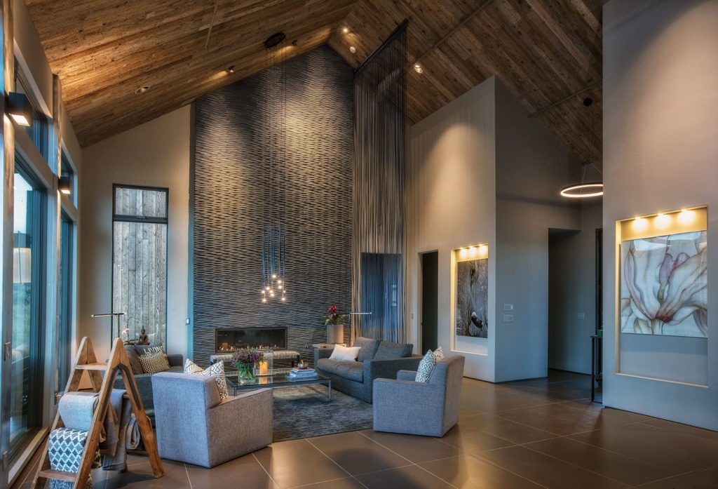 Shambala- Living Room with towering reclaimed wood ceilings and large format tile flooring