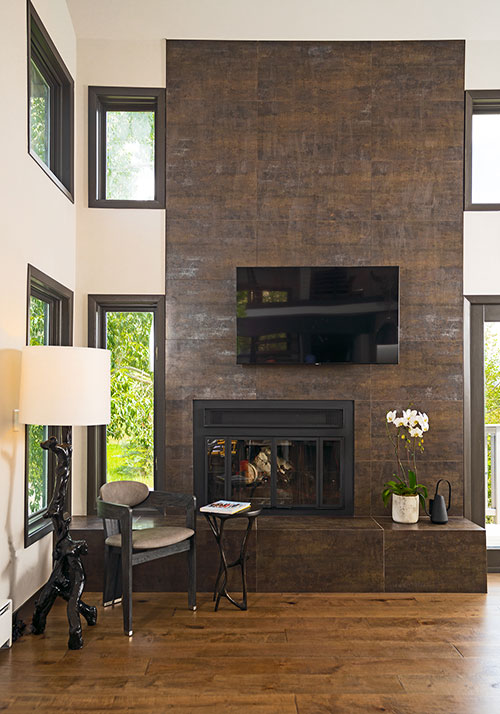 Singletree townhome remodel - fireplace with floor-to-ceiling tile and tiled hearth