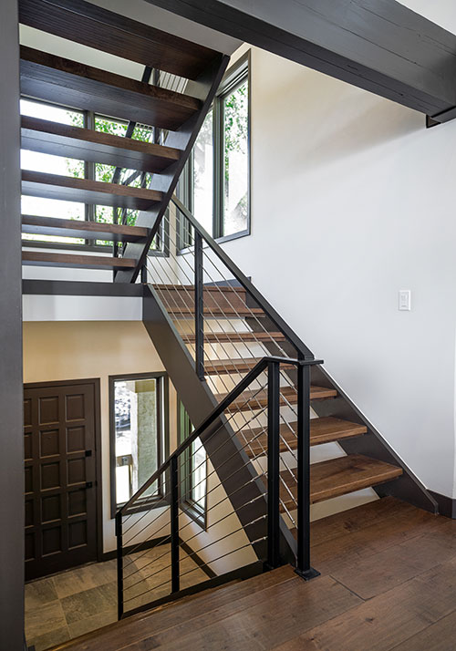 Singletree townhome remodel - floating stairs with metal railings and metal cables (front door angle)